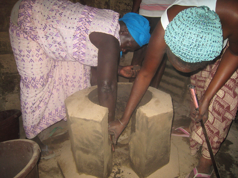 Women learn to construct improved cookstoves using free, locally available materials such as sand, clay, straw, and millet stalks. Improved cookstoves use 50 to 70 percent less firewood than traditional open cook fires.